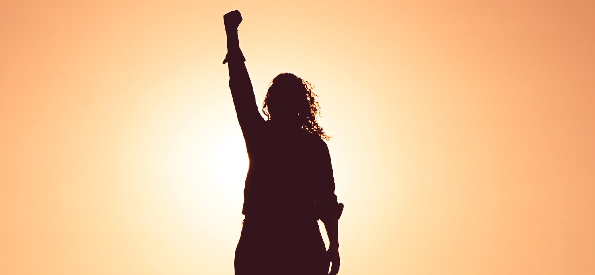 Woman holding fist in air