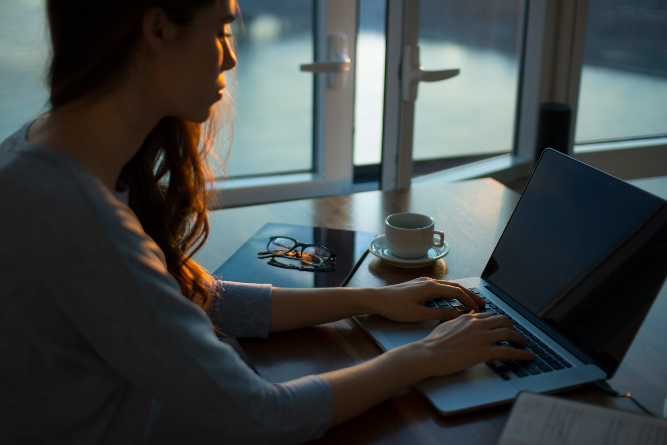 woman typing on computer