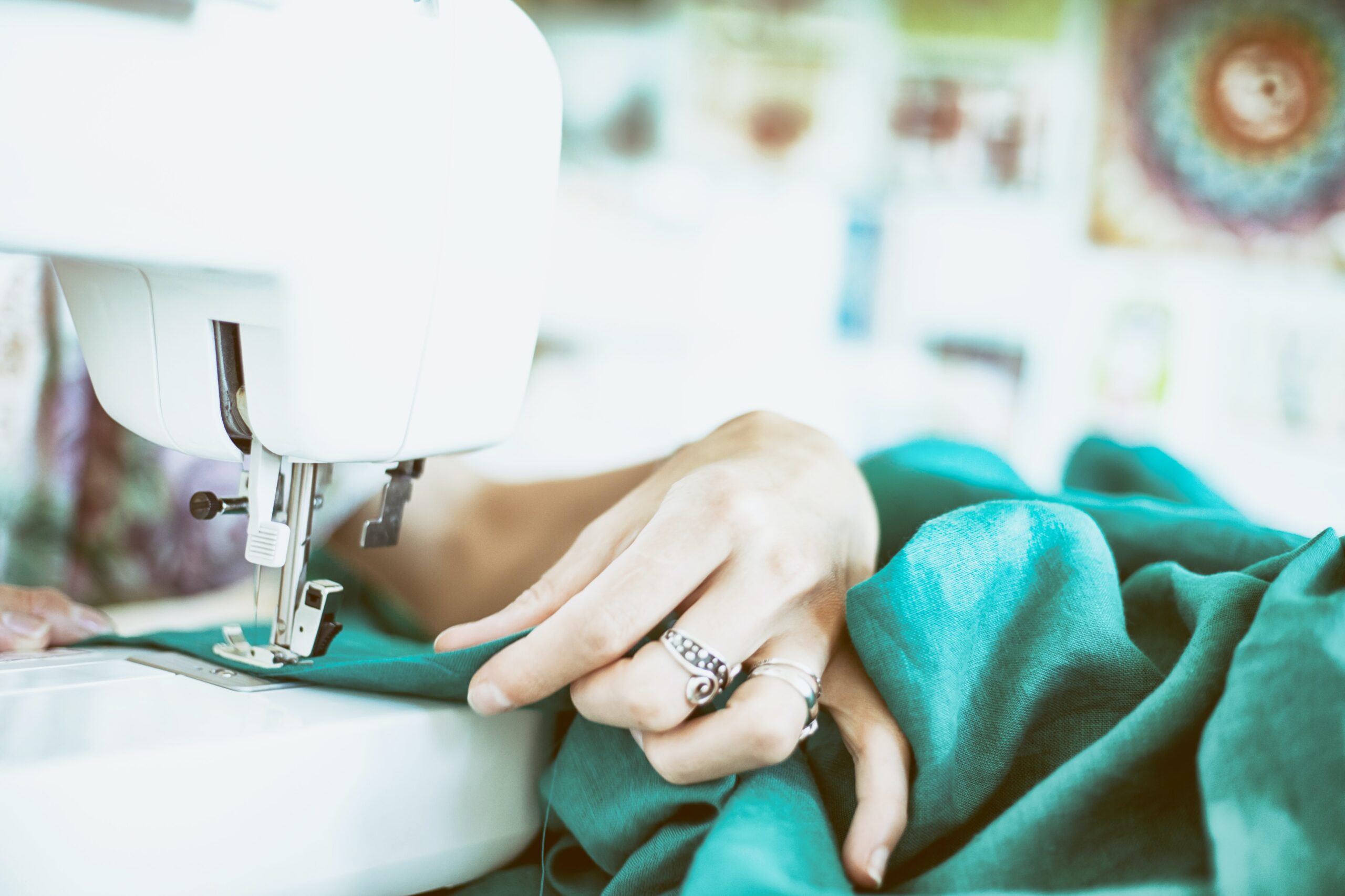 Person working with a sewing machine.