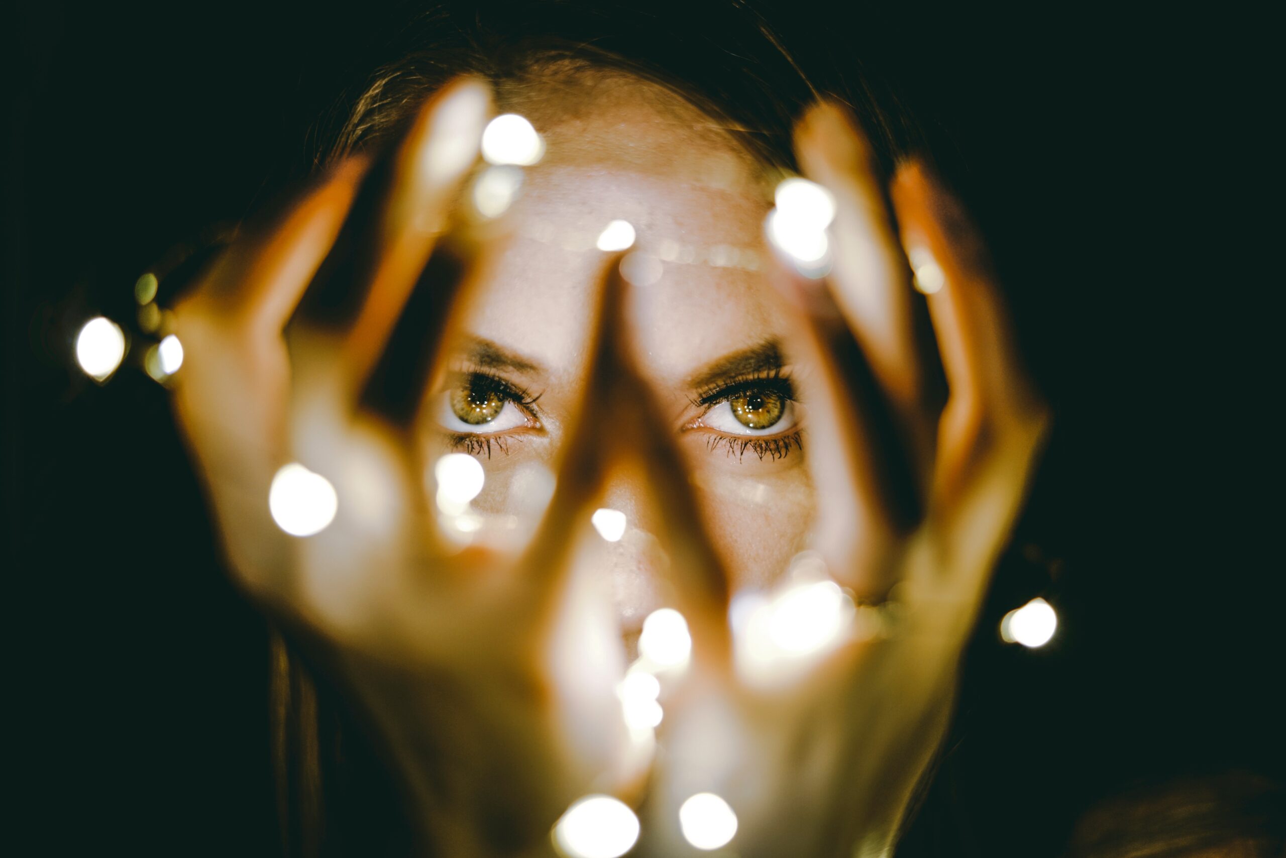 woman holding bright lights