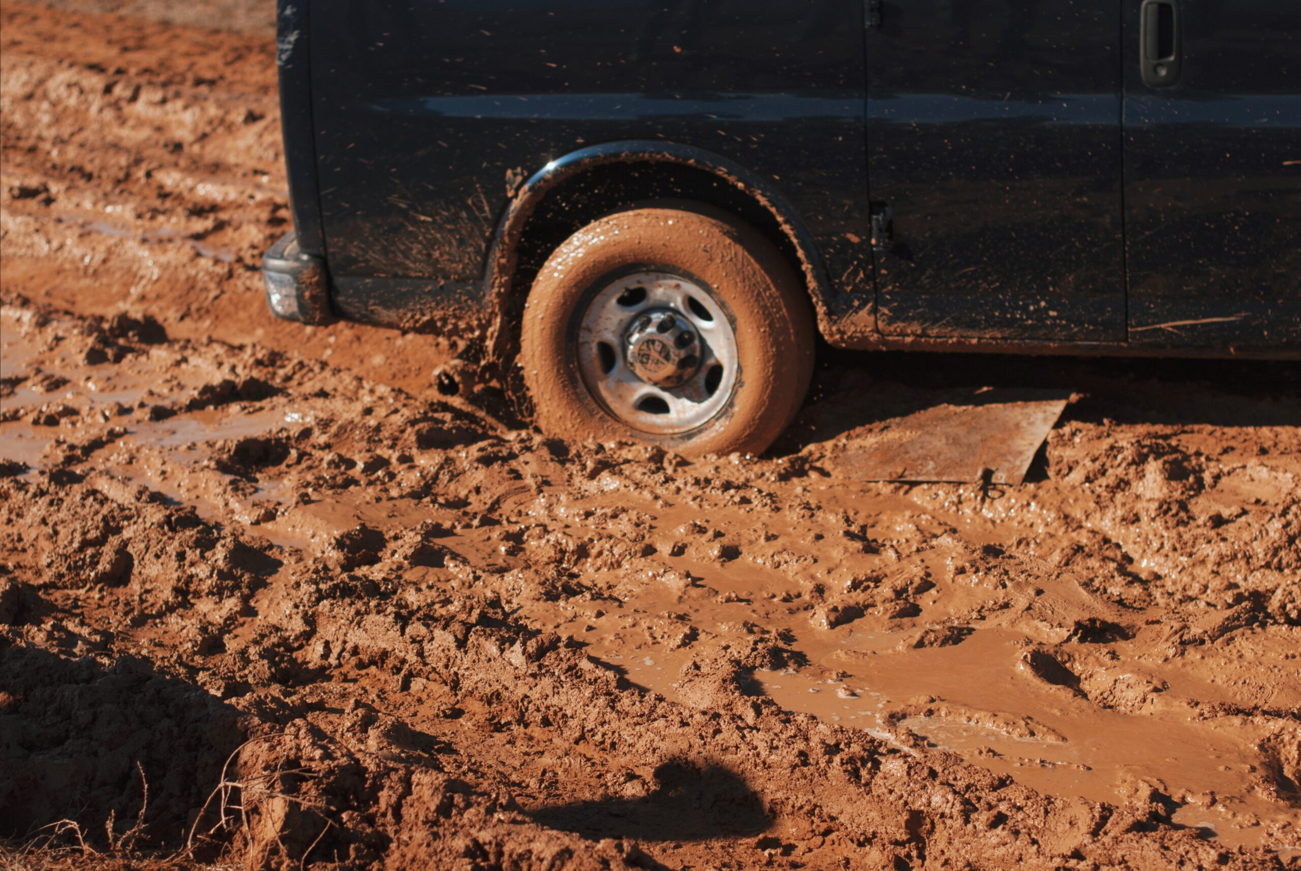 Pick up truck tire stuck in mud