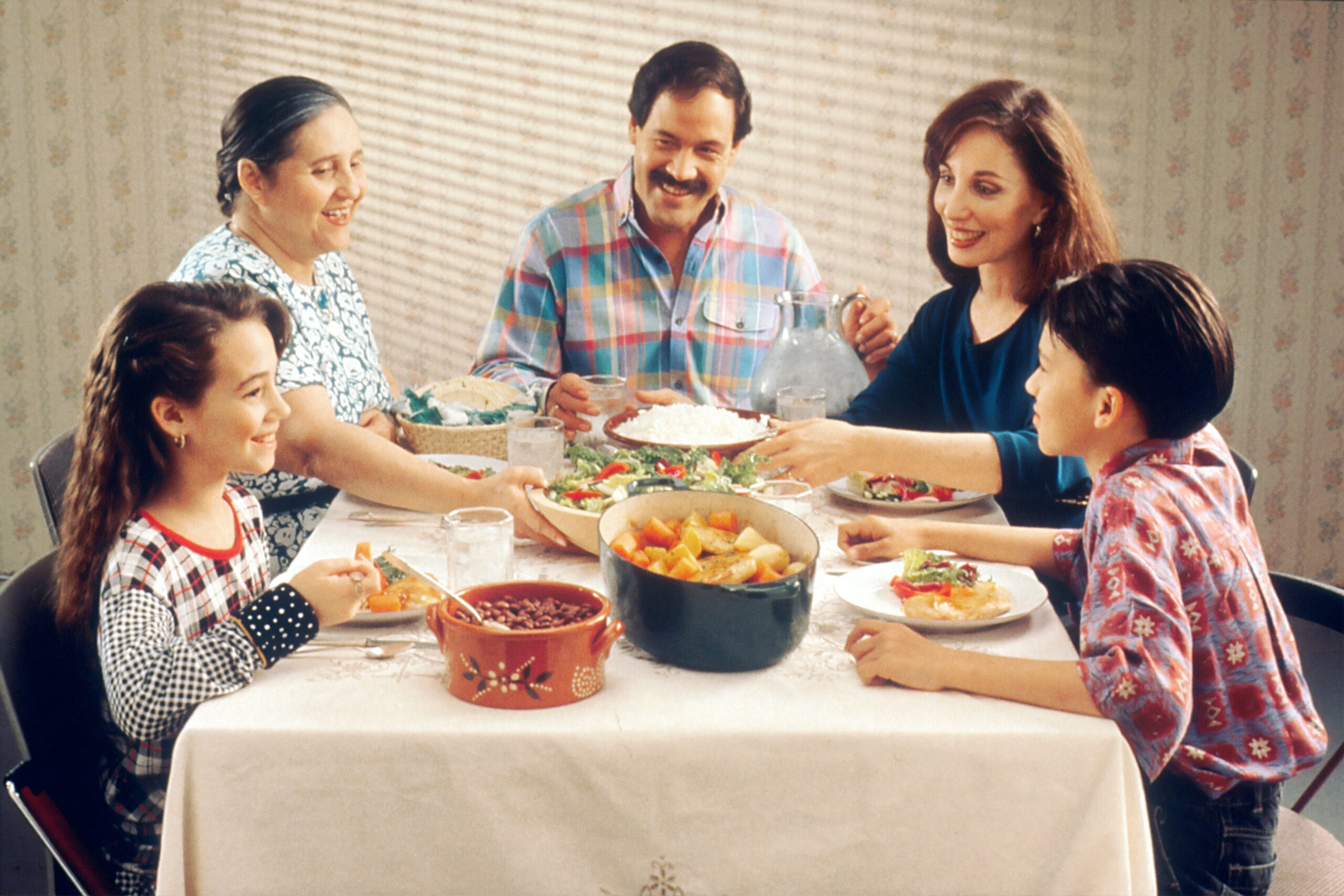 This picture shows a family of five having dinner-- A mother, father, grandma, and two children-- In the context of my blog post, this would be the primary Discourse of the two kids at the dinner table.