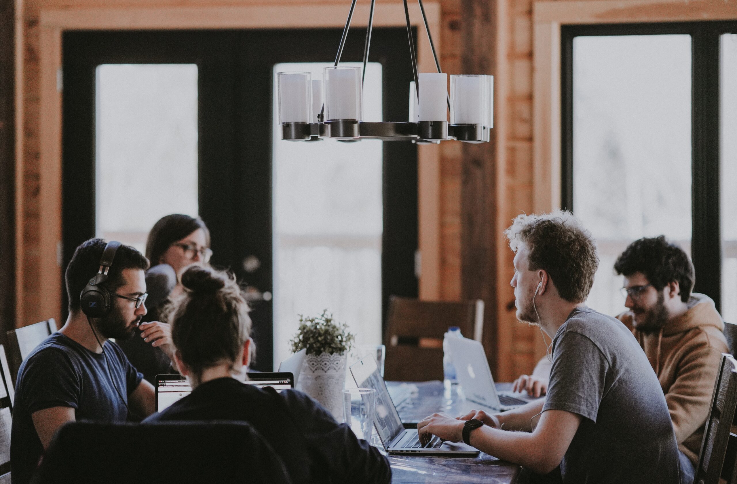 A group of people are sitting around a table.