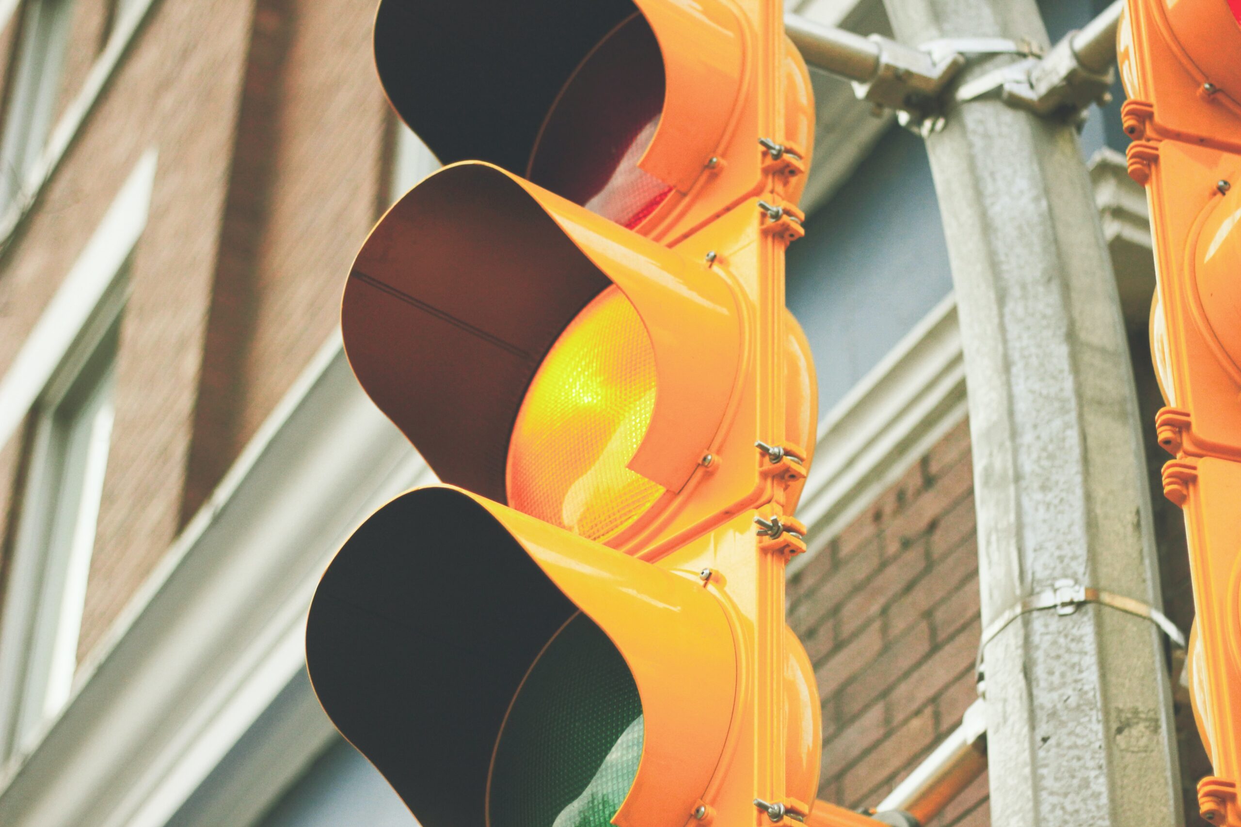 A traffic light showing the yellow light