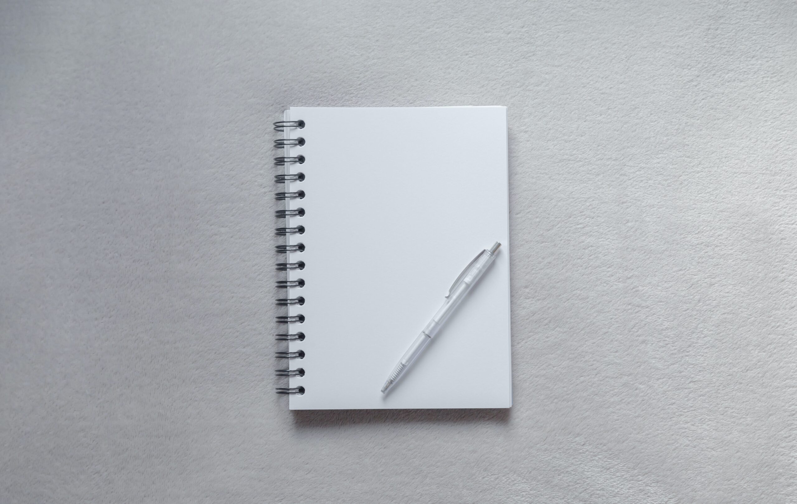 https://unsplash.com/photos/white-notebook-with-pen-on-top-1ixT36dfuSQ