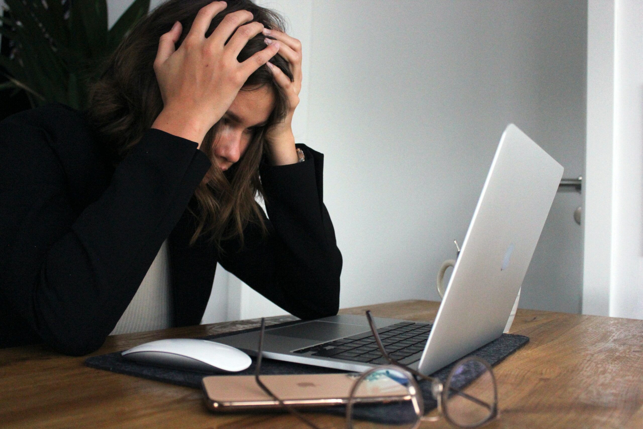 woman who is stressed and frustrated trying to write