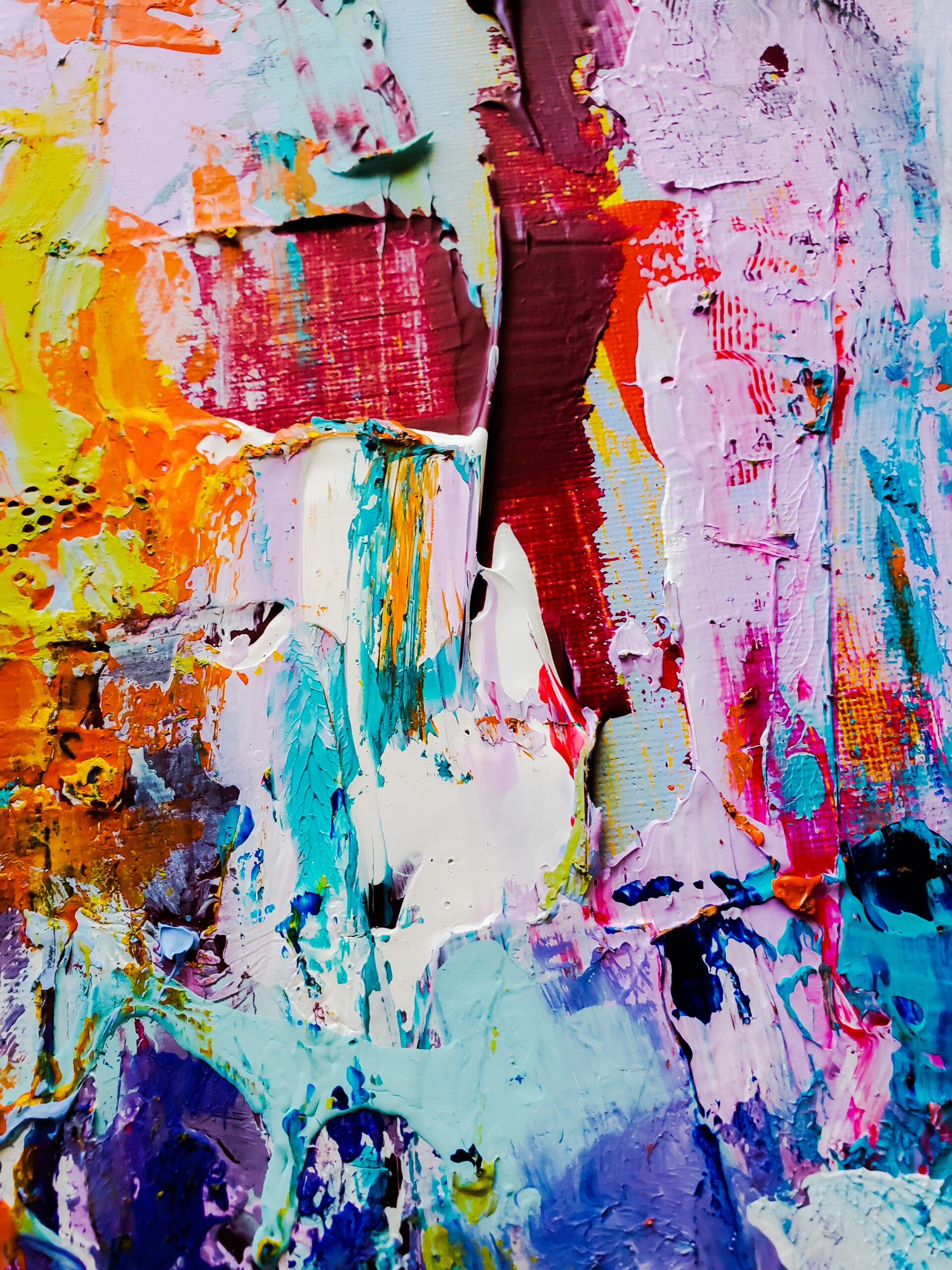A painting that includes no picture and contains the colors red, yellow, pink, blue, and white.