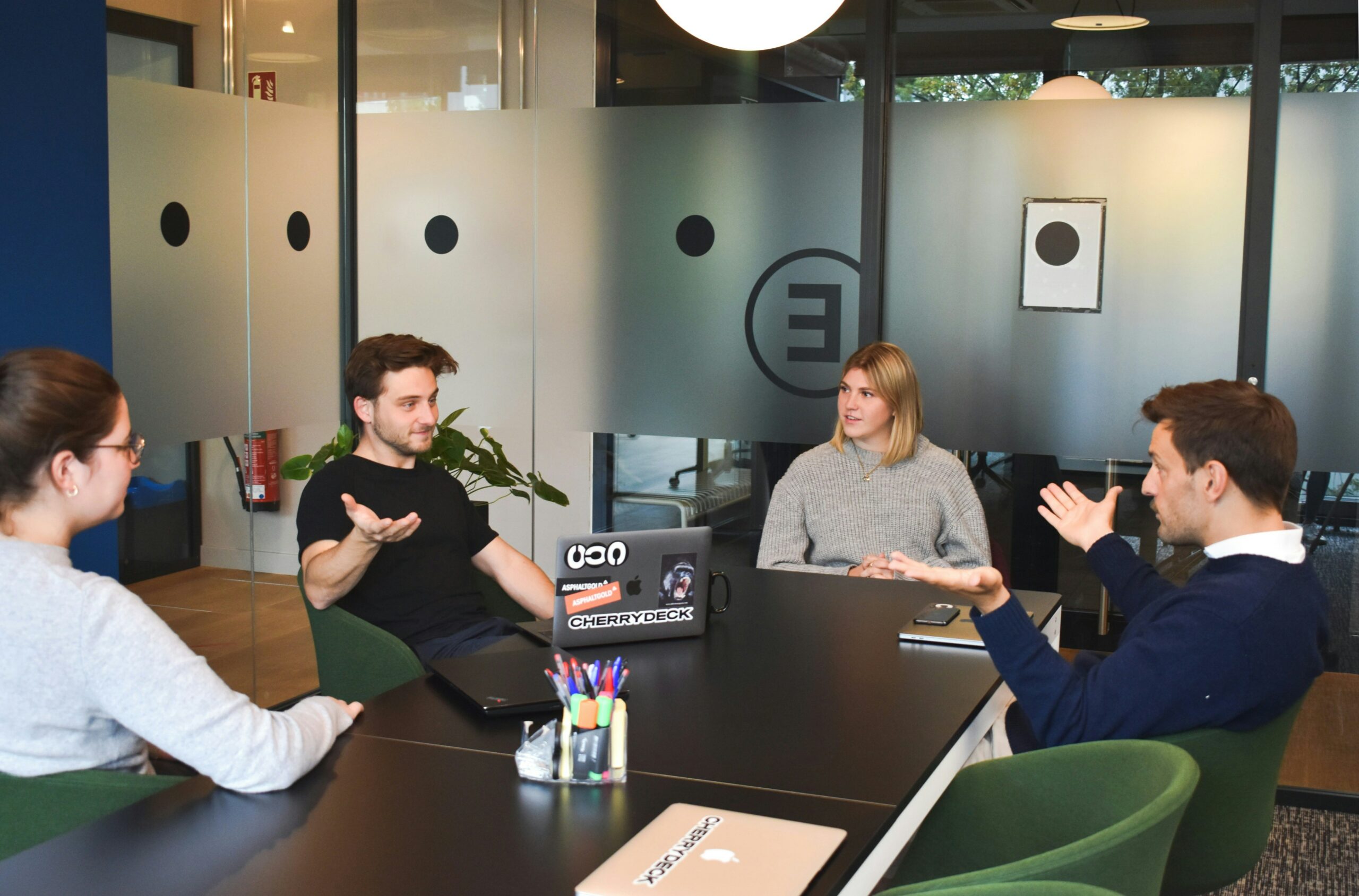 people sitting around table having academic or professional discussion