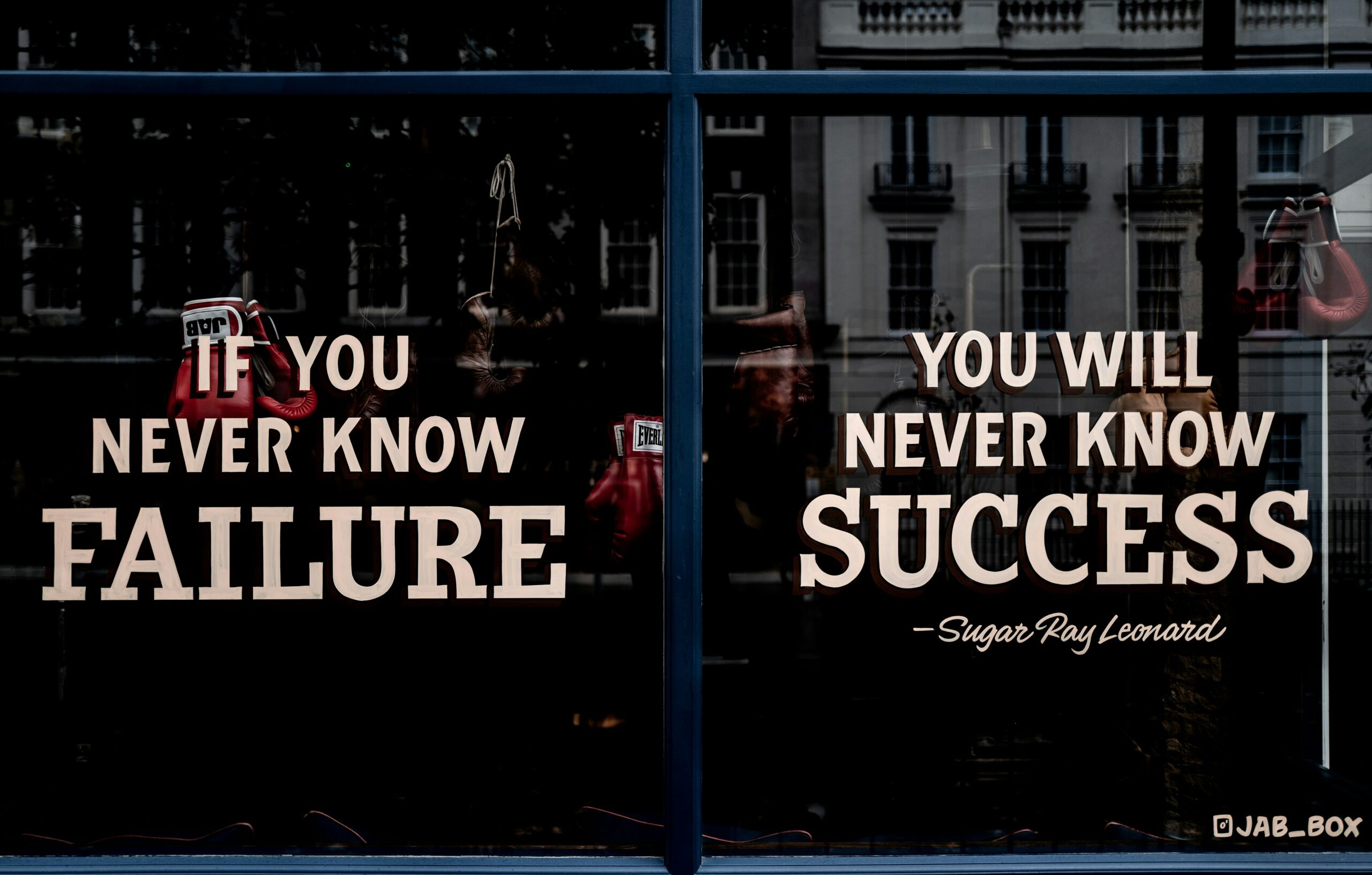 There is writing on glass that says if you never know failure, you will never know success.