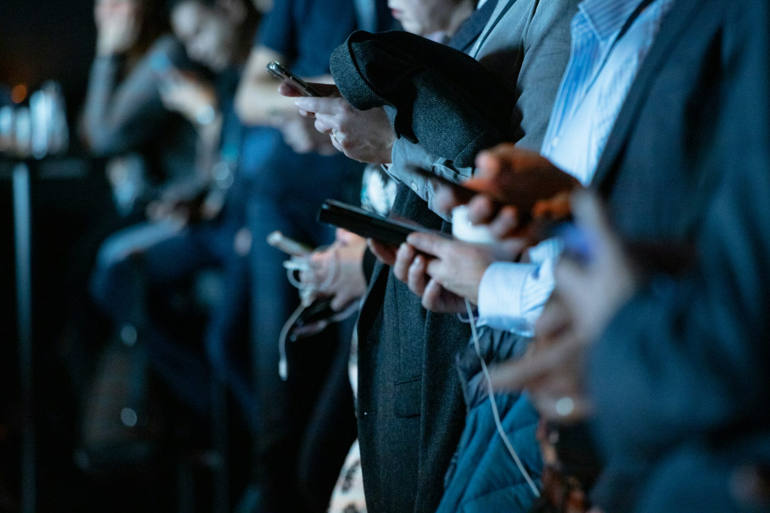 people looking down at their phones.