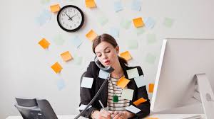 Woman answering phone and juggling tasks