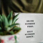 decoration saying "write without fear. edit without mercy."